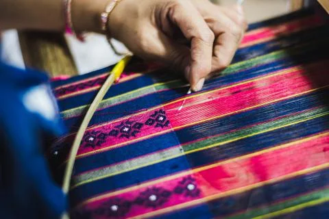 Thai woman making silk thread. A traditional way of hand made silk production Stockfoto's