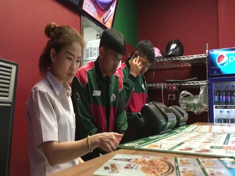 Thai workers pizzeria Stock Footage 71949635