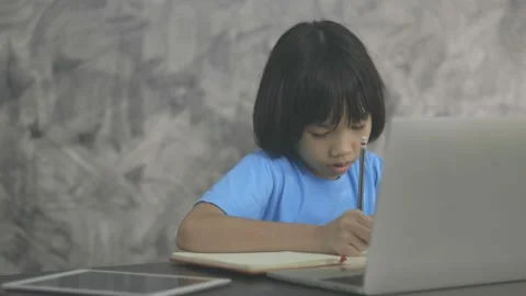 Thai young kid learning online at home Stock Footage 139956243
