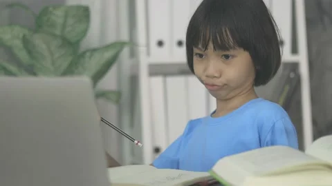 Thai young kid learning online at home Stock Footage 139956400