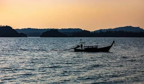 Thaiboot bei Krabi in Thailand bei Sonnenuntergang. *** Thai boat at Krab... Stock Photos