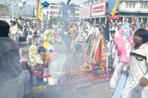  Thailand: Firecrackers explode over shrine bearers and they are quickly e... Stock Photos
