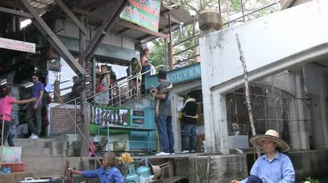 Thailand Floating Market Man with Python Stock Footage 8929288