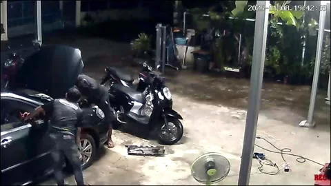 Thailand: Mechanic engulfed by fire when car engine explodes during repai... Stock Footage 321045282