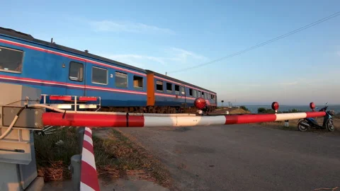 Thailand passengers train run pass through the road intersection. Stock Footage 151067646