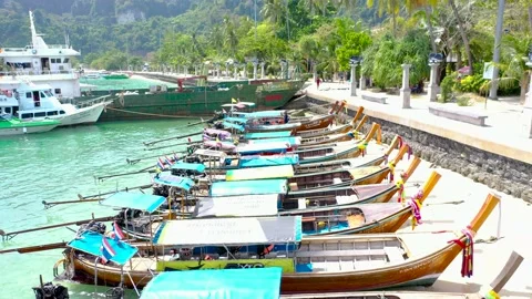 THAILAND, PHI PHI ISLANDS Exotic view of a long tail boata on the coast of Phi Vídeo Stock 147454356
