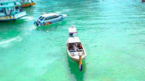 THAILAND, PHI PHI ISLANDS Exotic view of a long tail boata on the coast of Phi Stock Footage 147454630