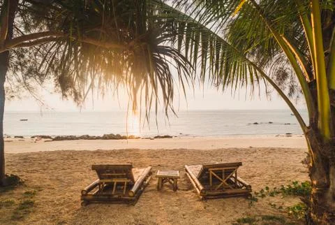 Thailand, Phi Phi Islands, Ko Phi Phi, sun loungers on the beach in backlight Stock Photos