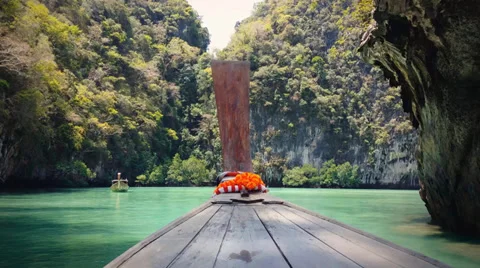 Thailand travel background. Exotic tropical island and wooden boat on sea. 4K Stock Footage
