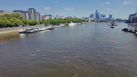 Thames river drone view with modern London skyline and boats on sunny day Stock Footage 309762834