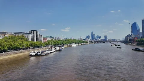 Thames river drone view with modern London skyline and boats on sunny day Stock Footage 309762836