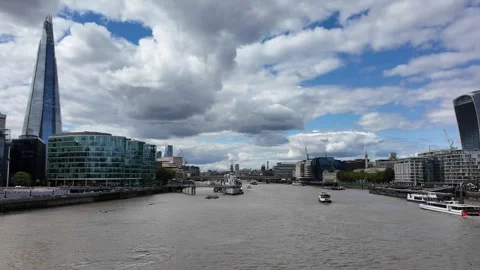 Thames River panning shot with The Shard and City skyline under clouds Stock Footage 346677718