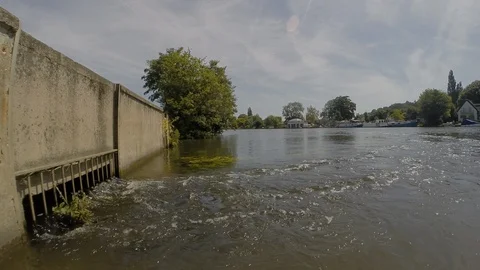 Thames Water sewage treatment outfall facing downstream Stock Footage