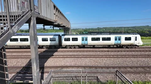 Thameslink Desiro City Comuter Train Passing the Solar Farm Near New Zealand Stock Footage 313696454