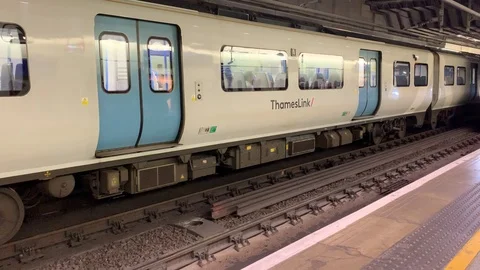 Thameslink Train arrives at the train station Stock Footage 112080475