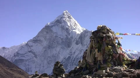 Thamserku Peak and prayer flags Lungta (flying horses). Himalayas. Nepal. Stock Footage 43741648