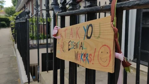 THANK YOU ALL ESSENTIAL WORKERS SMILEY - FRIENDLY SIGN COVID-19 LOCKDOWN 4K Stock Footage 130193548