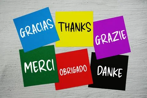 Thank You in different languages text on stick note on concrete background Stock Photos
