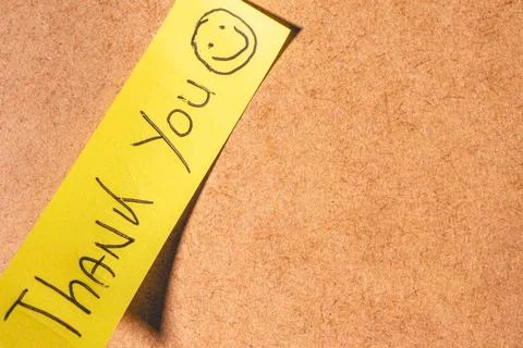 A Thank you note on a brown background Stock Photos