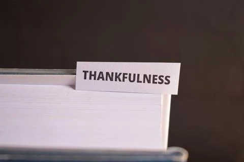 Thankfulness Bookmark Inserted in Book Representing Gratitude and Positive .. Фото