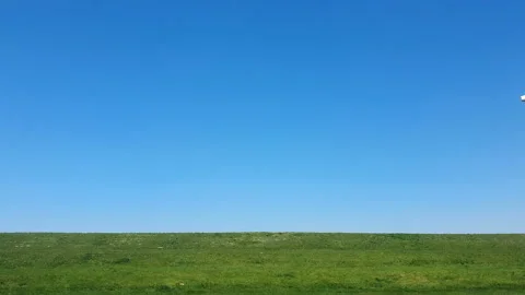 Thanksgiving against the blue sky. Windmill park in the lake IJsselmeer in Stock Footage 107265341