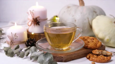 Thanksgiving concept autumn composition with tea, pumpkin and burning candles Stock Footage 168226406