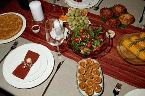 Thanksgiving Dinner Table Served with Festive Food for Holiday Celebration Stock Photos