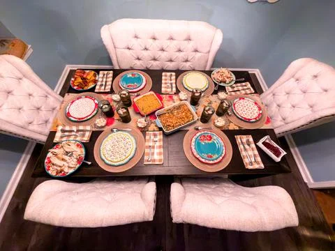 Thanksgiving Dinner Table Setting with Homemade Dishes from Above Stock Photos