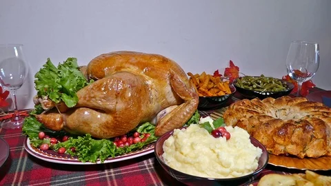 Thanksgiving dinner with turkey on dining table, Holiday meal with food Stock Footage 97251383