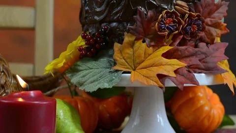 Thanksgiving Fall table setting with Autumn theme chocolate cake Stock Footage 69725246