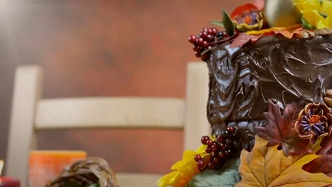 Thanksgiving Fall table setting with Autumn theme chocolate cake, fruit, corn Stock Footage 81728113