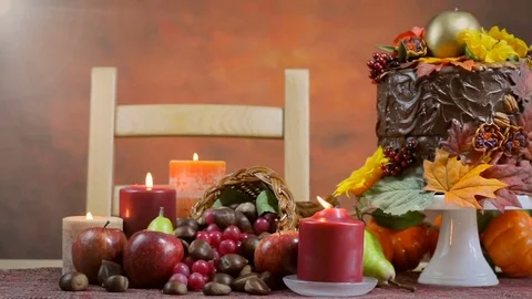 Thanksgiving Fall table setting with Autumn theme chocolate cake, fruit, corn Stock Footage 81728319