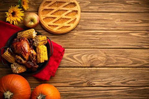 Thanksgiving festive table composition with roasted turkey, pumpkin pie, autu Stock Photos