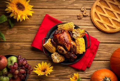 Thanksgiving festive table composition with roasted turkey, pumpkin pie, autu Stock Photos
