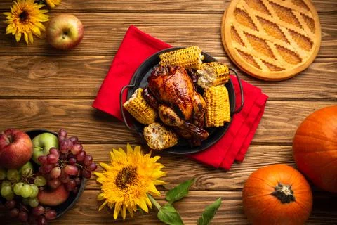 Thanksgiving festive table composition with roasted turkey, pumpkin pie, autu Stock Photos