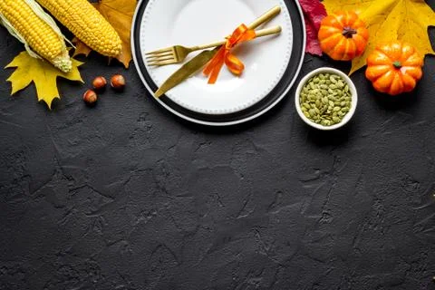 Thanksgiving flat lay with table setting leaves and pumpkins, overhead view Stock Photos