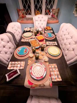 Thanksgiving Holiday Dinner Table Setting in Home Dining Room Stock Photos