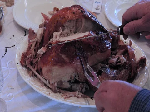 Thanksgiving table carving Turkey for feast DCI 4K Stock Footage