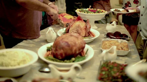 Thanksgiving Table Dishes and Side Dishes Man Carving Slicing Serving Turkey 動画素材 44397109