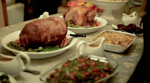 Thanksgiving Table with Family Passing Around Plates Stock Footage
