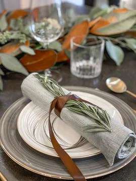 Thanksgiving table setting with fresh pumpkins and flowers in room Stock Photos