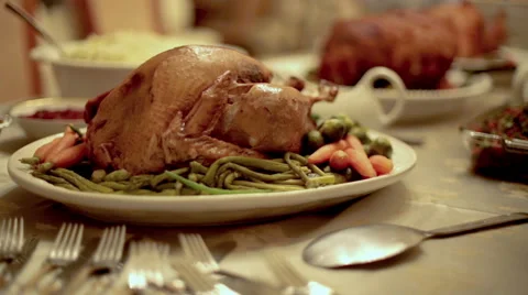 Thanksgiving Table with Turkey, Ham, and Side Dishes on the Holidays Stock Footage 44396648