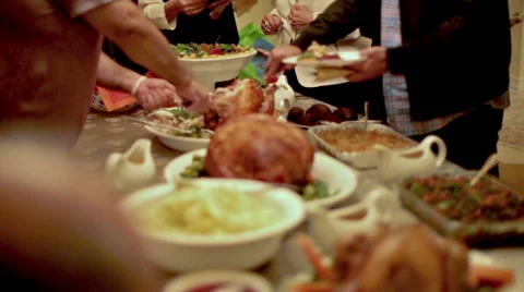 Thanksgiving Table with Turkey, Ham, and Side Dishes on Beautiful Display Stock Footage 44397013