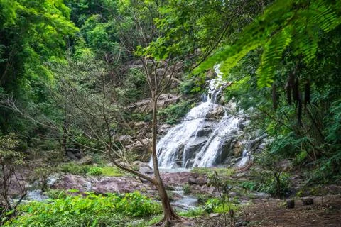 Thanthip Waterfall in the green forest with streamed water flowing on the ste Stock Photos