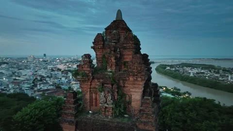 Thap Nhan Cham Tower over Tuy Hoa coastal town at dusk Stock Footage 337356029