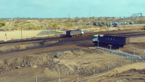 Thar Engro Coal Mining Trucks Moving Through Dry Sindh Worksite Stock Footage 344055680