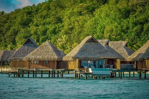 Thatched Huts Built Over the Water Stock Photos