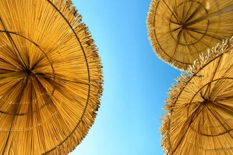 Thatched umbrellas Stock Photos