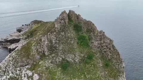 Thatcher Rock seen from clifftip footpath in Wellswood, Torquay, Devon, UK Stock Footage 282371081