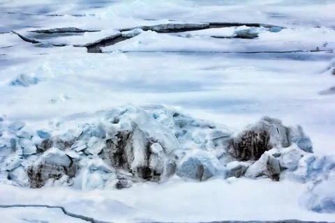 Thawed hummock of coastal ice Stock Photos